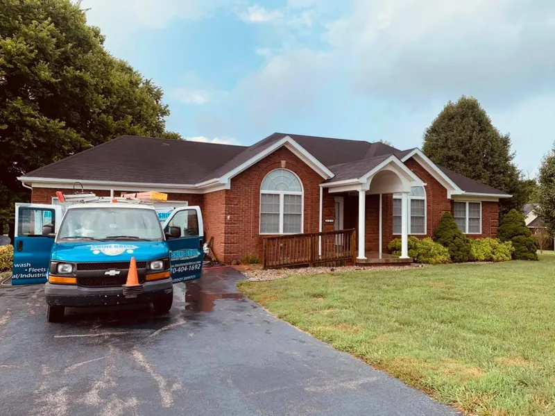 Brick home with a freshly cleaned driveway